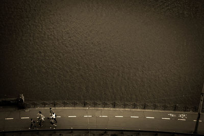 High angle view of people sitting on road at night