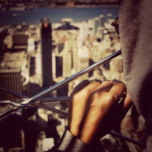 Close-up of man holding chain