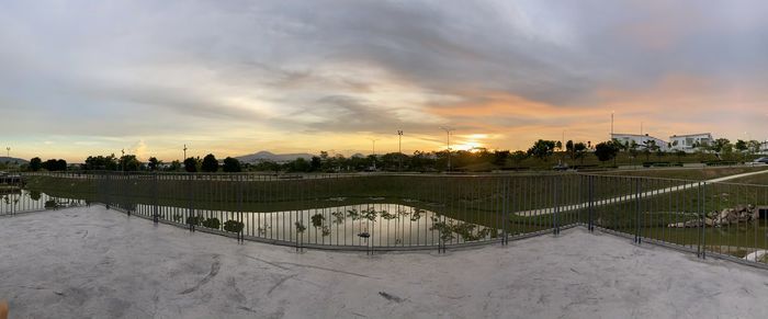 Scenic view of field against sky during sunset