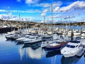 Boats moored at harbor