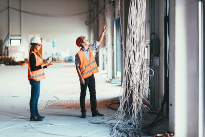 Architects examining cables at site