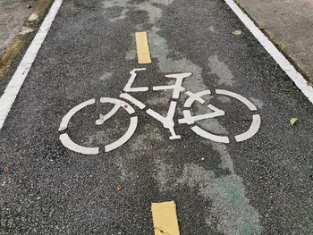 High angle view of bicycle sign on road