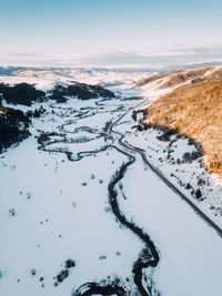 Scenic view of snow covered mountain against sky