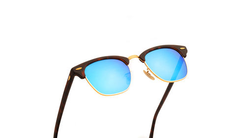 Close-up of sunglasses against white background