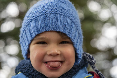 Portrait of smiling boy in snow