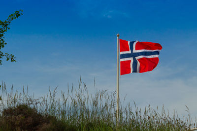 Low angle view of flag against sky