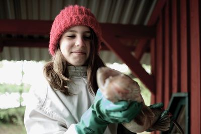 Portrait of smiling girl holding fish