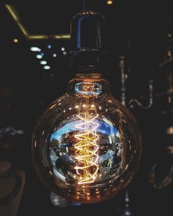 Close-up of illuminated light bulb