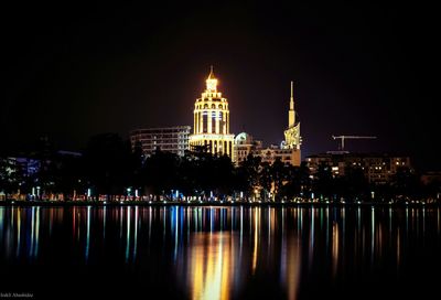 Reflection of illuminated buildings in water at night