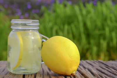 Close-up of fruits in glass jar on table