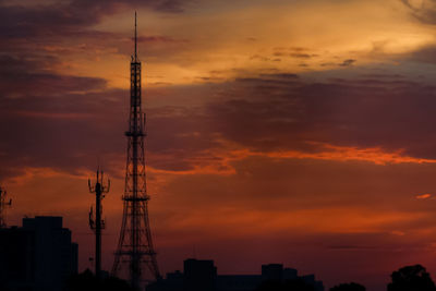 Low angle view of silhouette buildings against sky during sunset