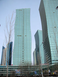 Low angle view of modern buildings against clear sky