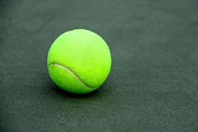 Close-up of tennis ball on court