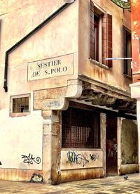 Graffiti on wall of old building
