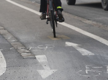 Man riding bicycle on road