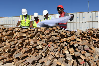 Engineers working over blueprint