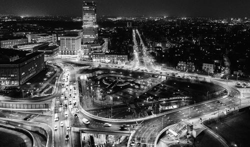 High angle view of illuminated buildings in city at night