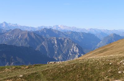 Scenic view of mountains against clear blue sky