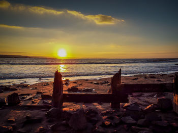 Scenic view of sea against sky during sunset