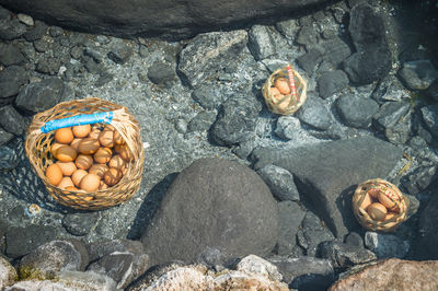 High angle view of wicker baskets with eggs in hot spring pond