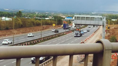 Cars on road against sky