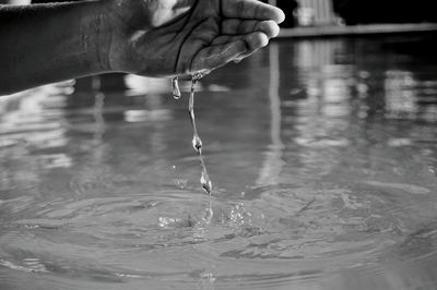 Close-up of hand holding water