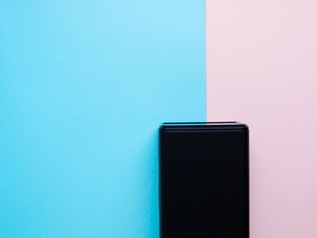 Full frame shot of blue paint on table against wall