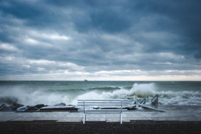 Scenic view of sea against storm clouds