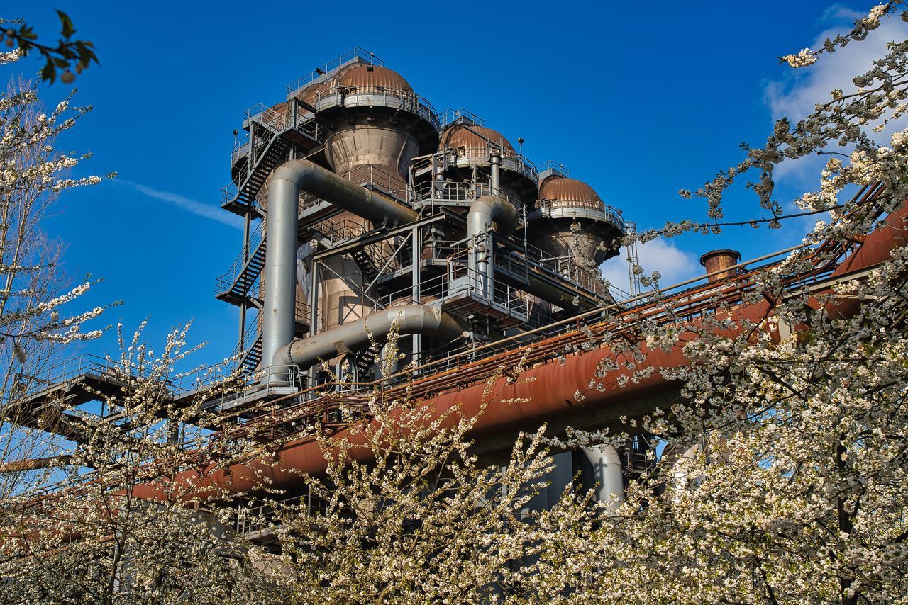 LOW ANGLE VIEW OF RUSTY METAL AGAINST SKY