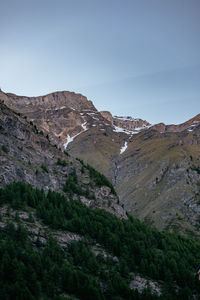 Scenic view of rocky mountains against clear sky