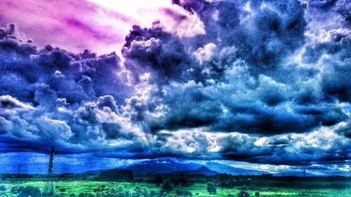 Scenic view of dramatic sky over field