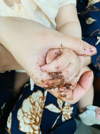 Midsection of woman holding ice cream