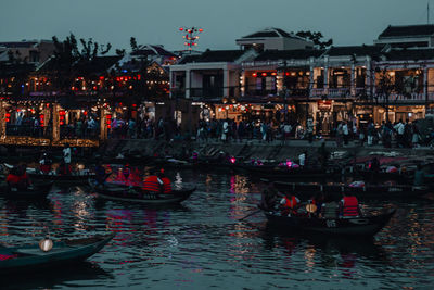 Boats in canal at night