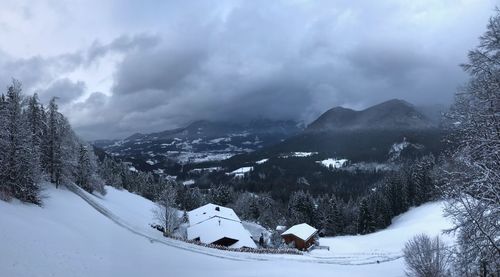 Scenic view of snow covered mountains against sky