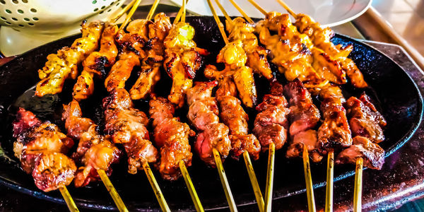 High angle view of meat on barbecue grill