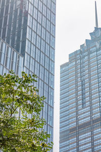 Low angle view of modern buildings against clear sky