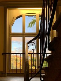 Interior of house against sky seen through window