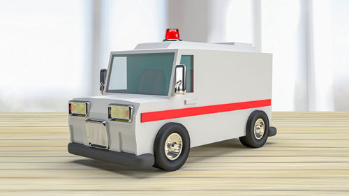 Toy car on white wall