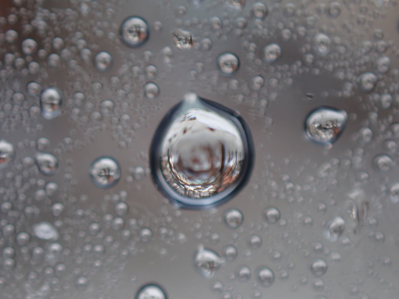 WATER DROPS ON GLASS