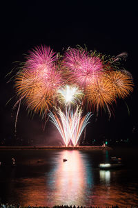 Firework display at night