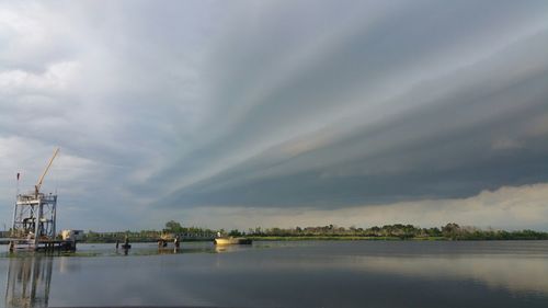 Scenic view of sea against cloudy sky