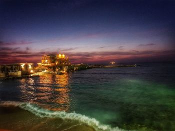 Scenic view of sea against sky at night