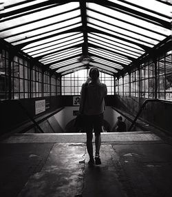 Low angle view of woman in dark room