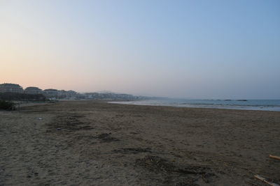 Scenic view of beach against clear sky