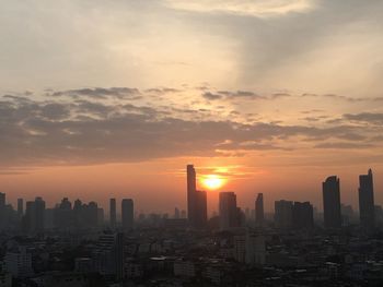 Cityscape against sky during sunrise