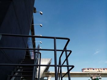 Low angle view of building against clear blue sky