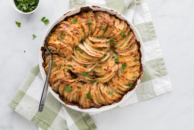 Creamy au gratin scalloped potatoes, fresh out of the oven, ready for serving.