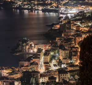 High angle view of illuminated buildings in city at night