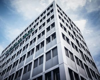 Low angle view of office building against sky