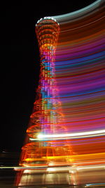 Low angle view of light trails at night